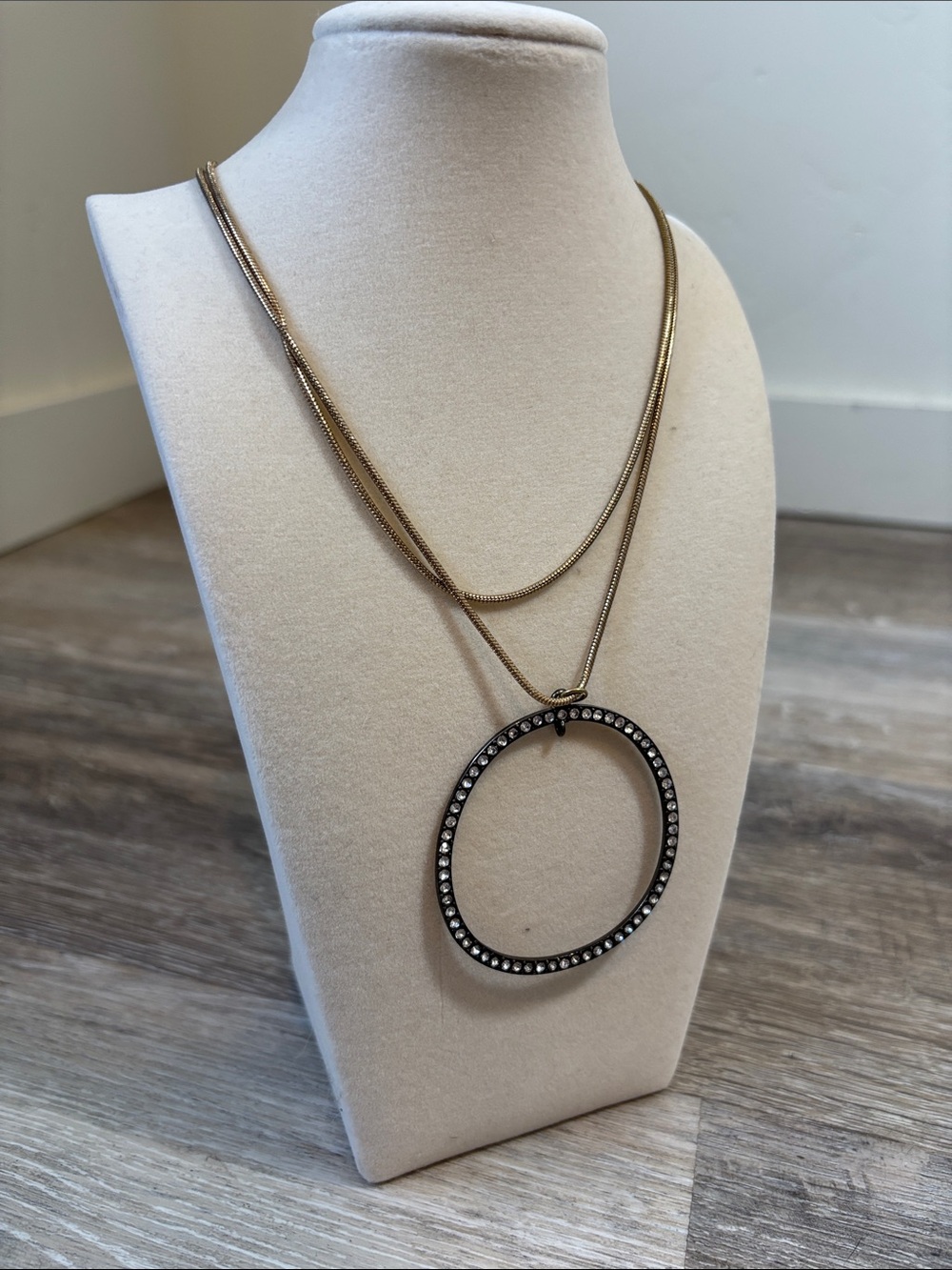 Gold-Tone Layered Necklace with Crystal-Studded Circular Pendant